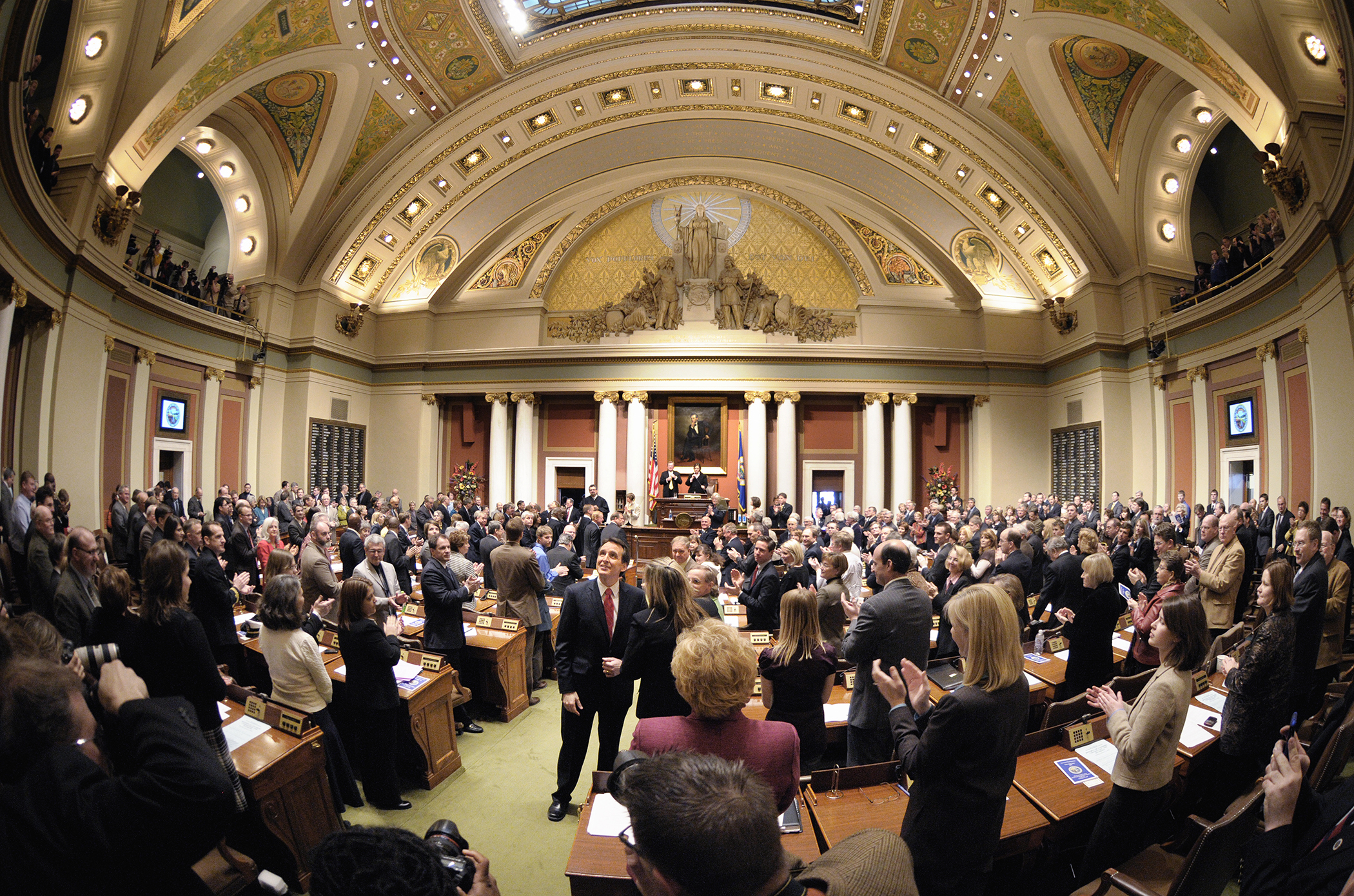 
Then-Gov. Tim Pawlenty enters the House Chamber to deliver his 2010 State of the State address. A governor's annual address to the Legislature is mandated by the Minnesota Constitution, though was first called a 'State of the State' speech in 1969. (House Photography file photo)